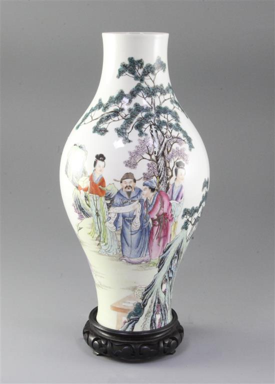 A Chinese famille rose baluster shaped vase, 20th century, height 33cm, wood stand